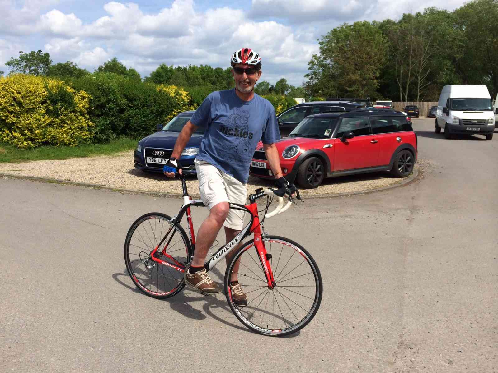 Frank, a man on a red bike