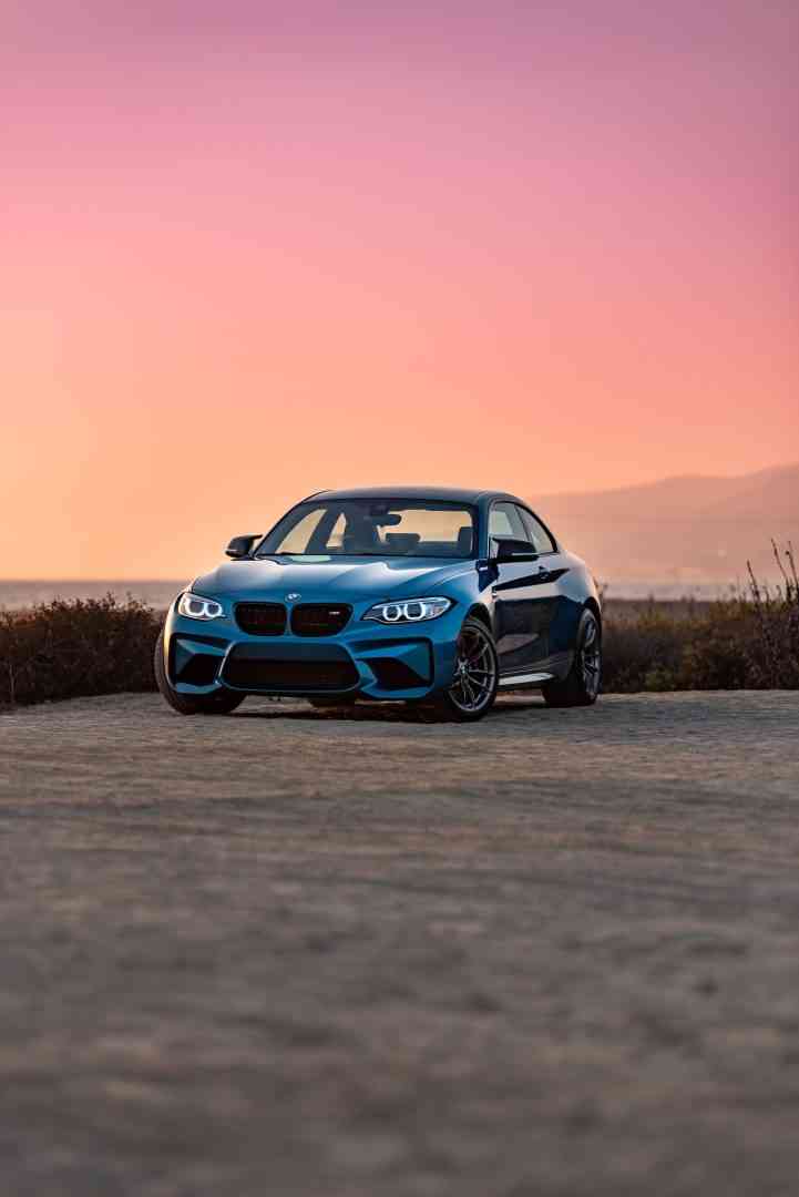 BMW at sunset in a carpark