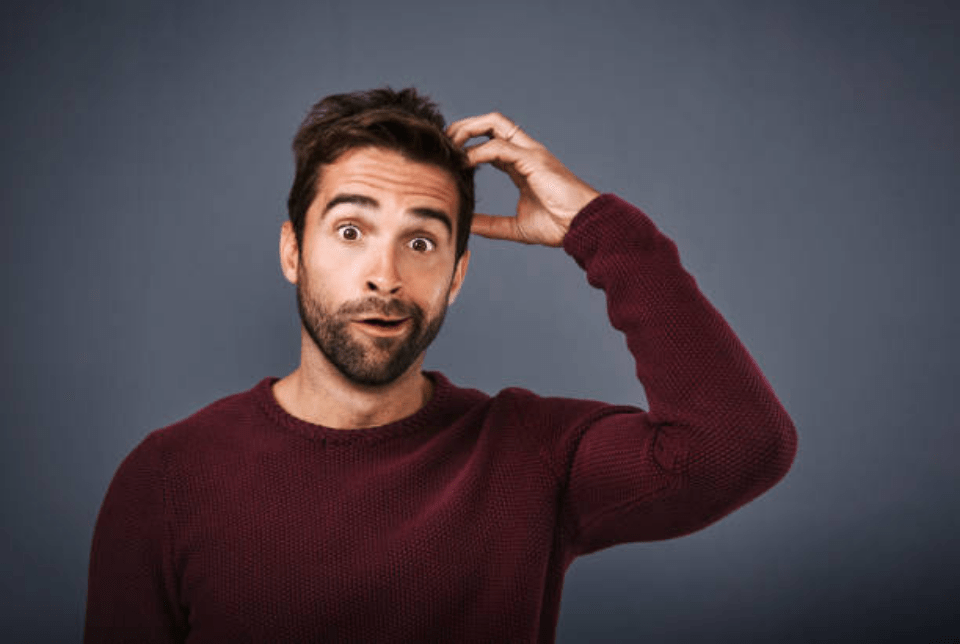 Person Scratching Their Head
