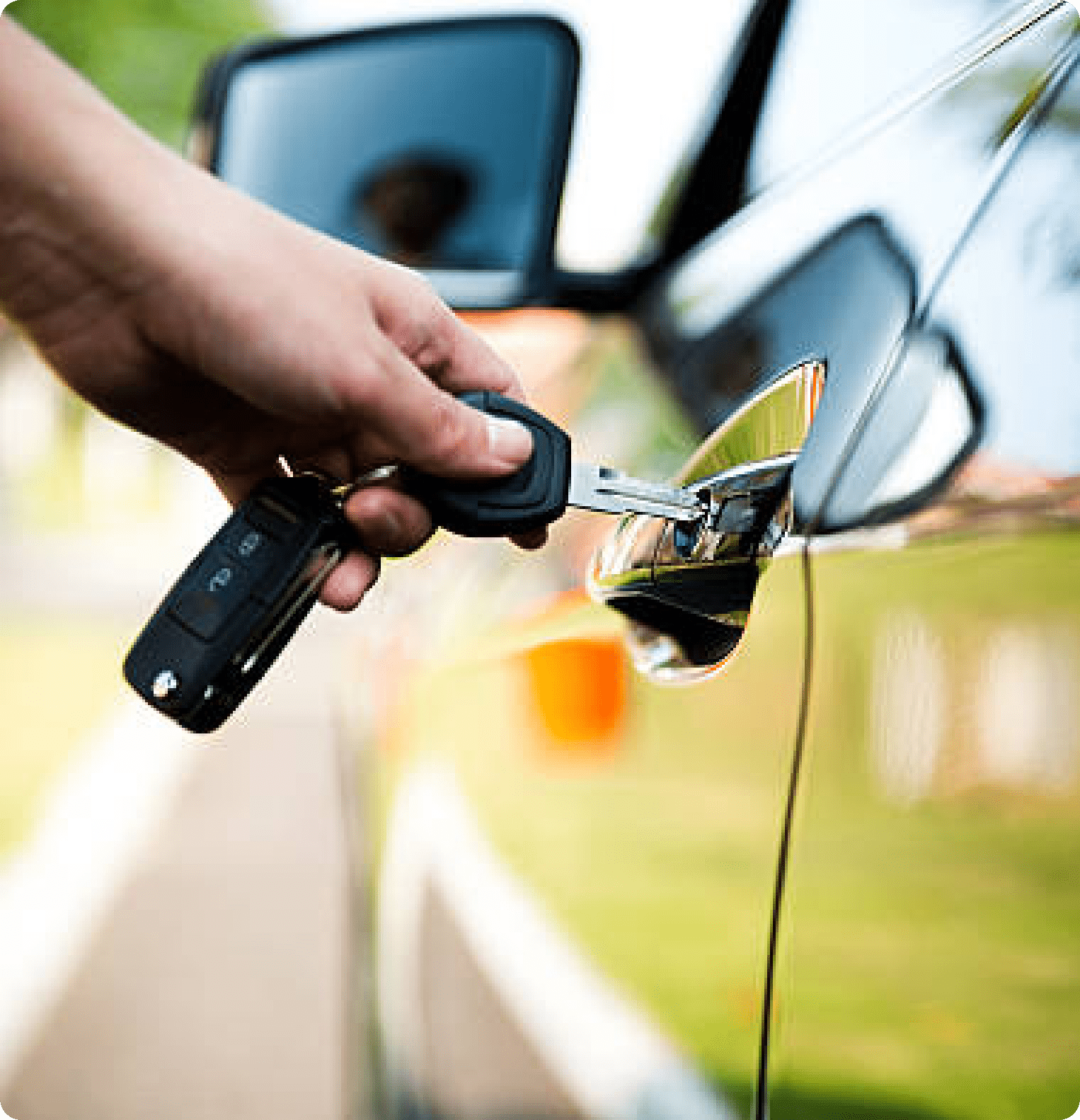 Person Using Car Keys to Open Car Door
